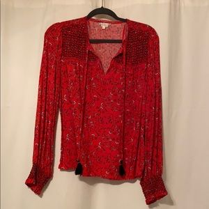 Red patterned blouse